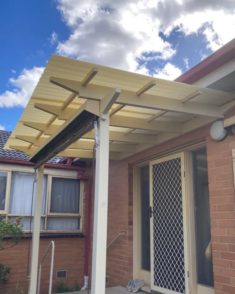The corresponding patio view with a roofed structure above the entrance.